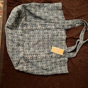 Never Used with tags Michael Kors indigo bag with front pocket and inside pocket